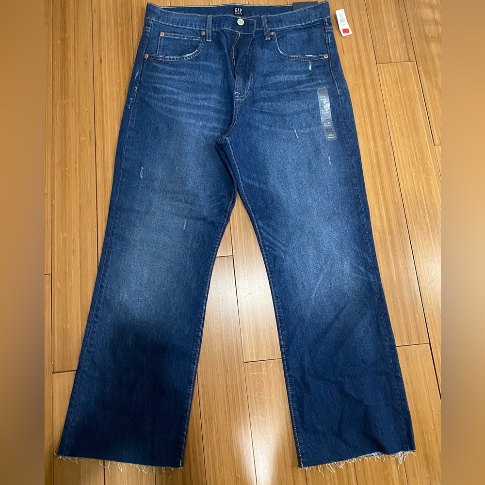 GAP blue jeans with frayed edge.